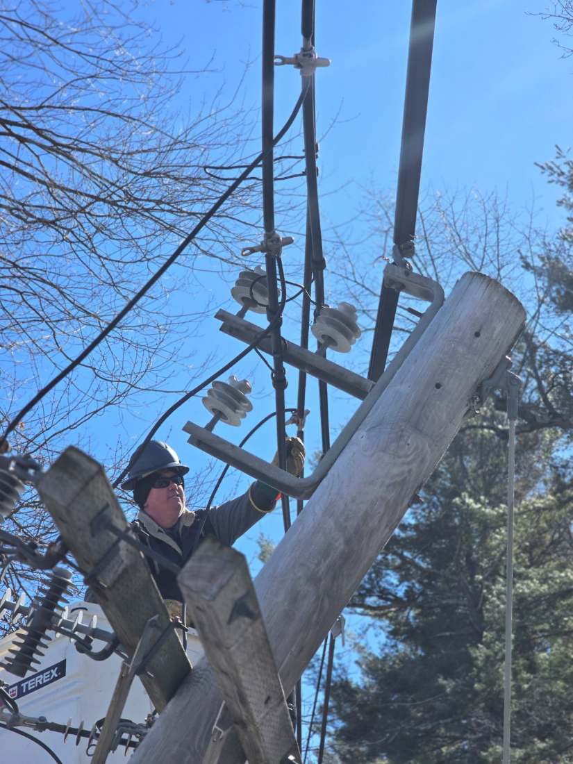 Lineman working a pole top
